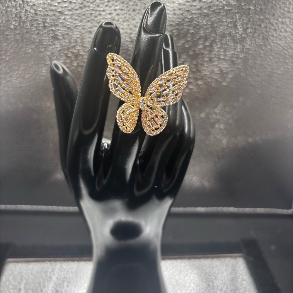 Elegant Gold Butterfly Ring Totally Adjustable . Everything is brand new.